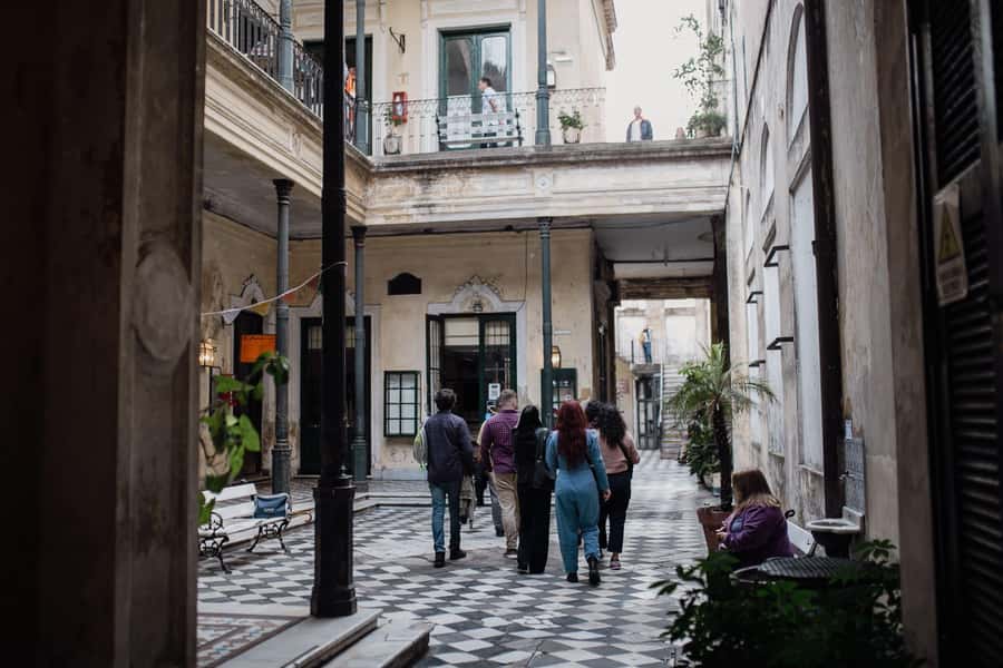 San Telmo: Historical Guided Tour with Street Food & Drinks - Cobblestone Walking Tour, Learning the Stories Behind the Streets